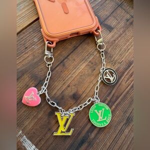 LV luxury enameled charms and silver phone chain bag charm.